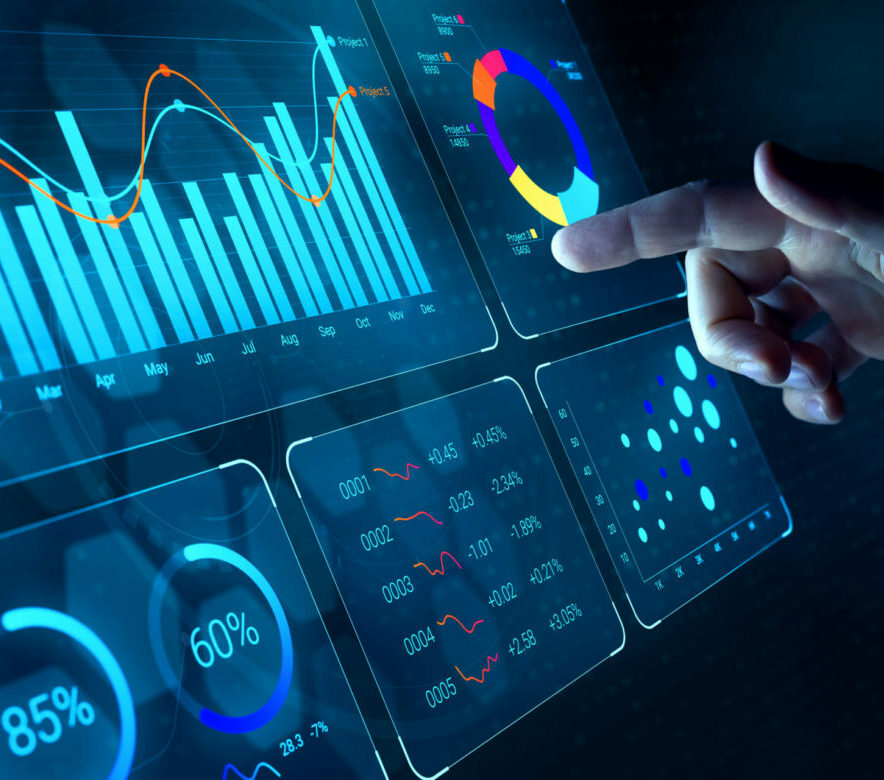 Data analyst working on business analytics dashboard with charts
