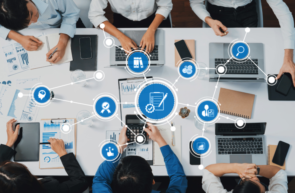 Collaborative Business Meeting with Digital Devices and Data Analysis Charts for Effective Strategy Development and Team Innovation. Amity
